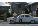 Howard & friend taking a refreshment (San Miguel) break along the road to Bataan Peninsula