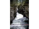 Natural Bridge Area cut through old lava flows